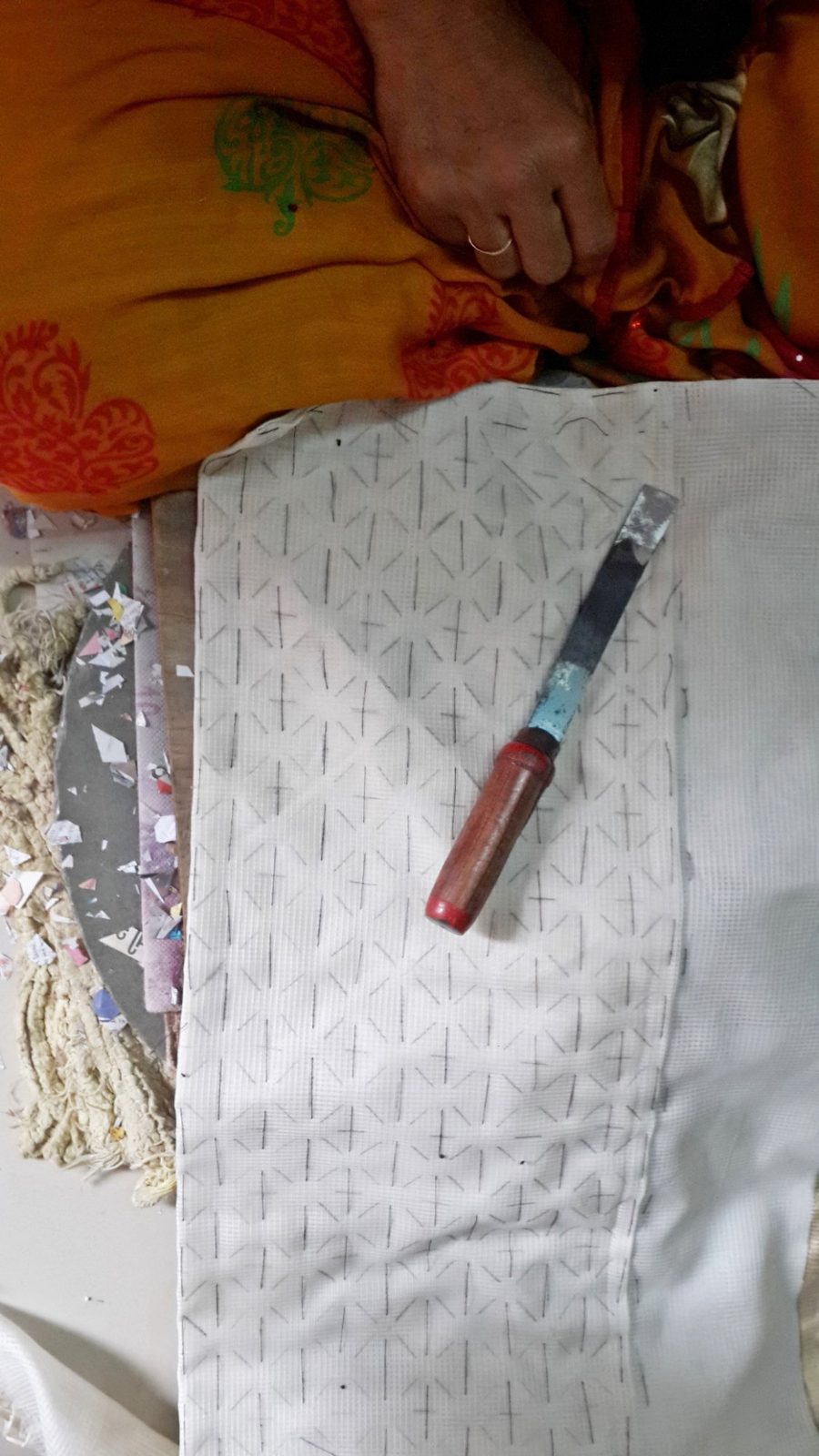 Cutting the fabric by hand