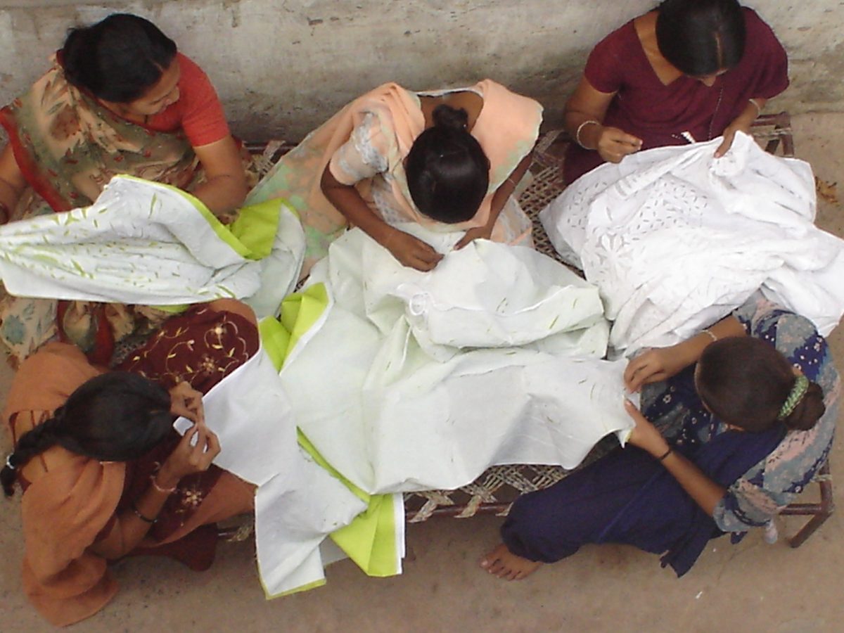Artisans working on Gujarati cutwork sarees